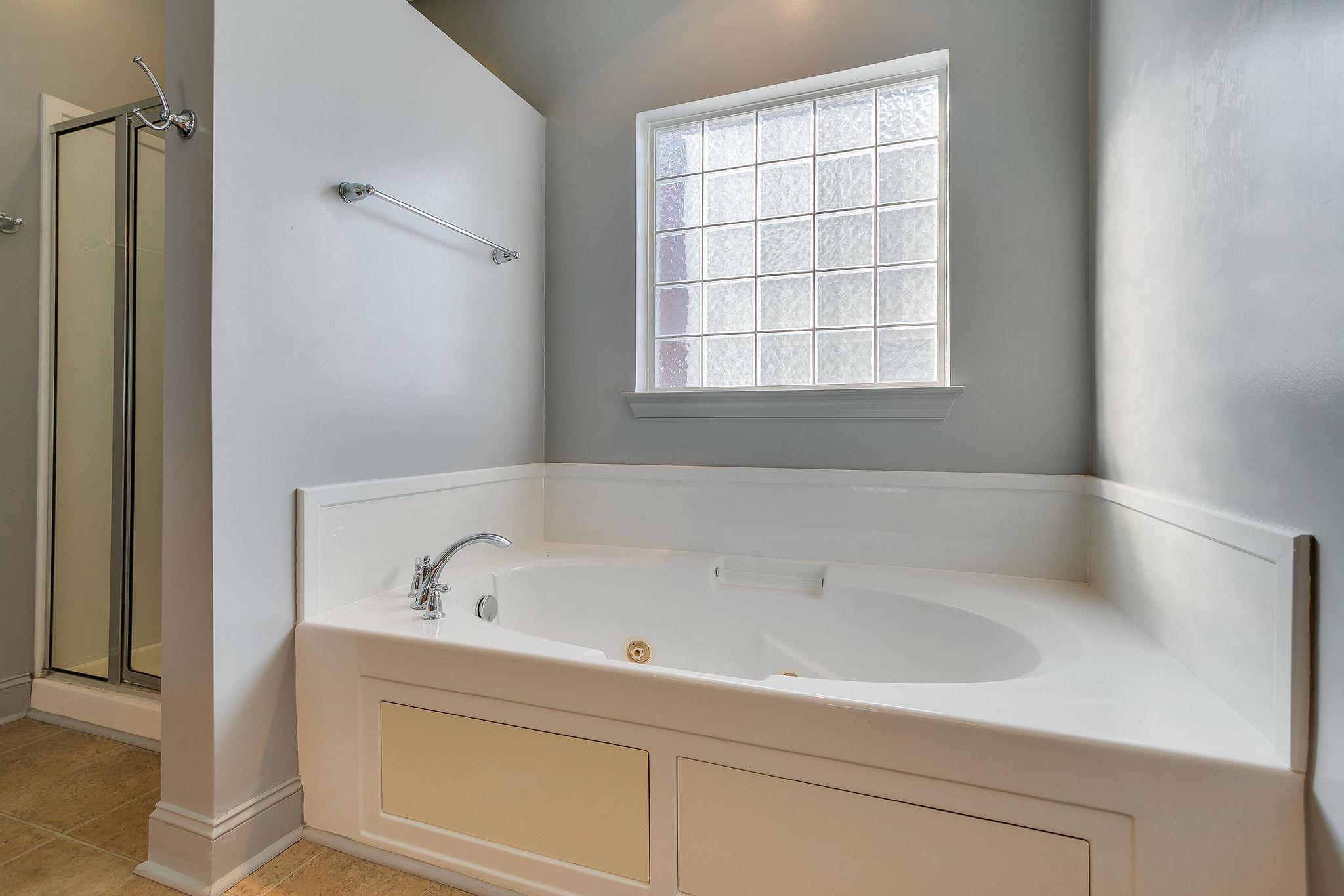 2029 Lincoln Road Spring Hill, TN 37174 - Photo 13 of 30 a white bath tub sitting next to a window