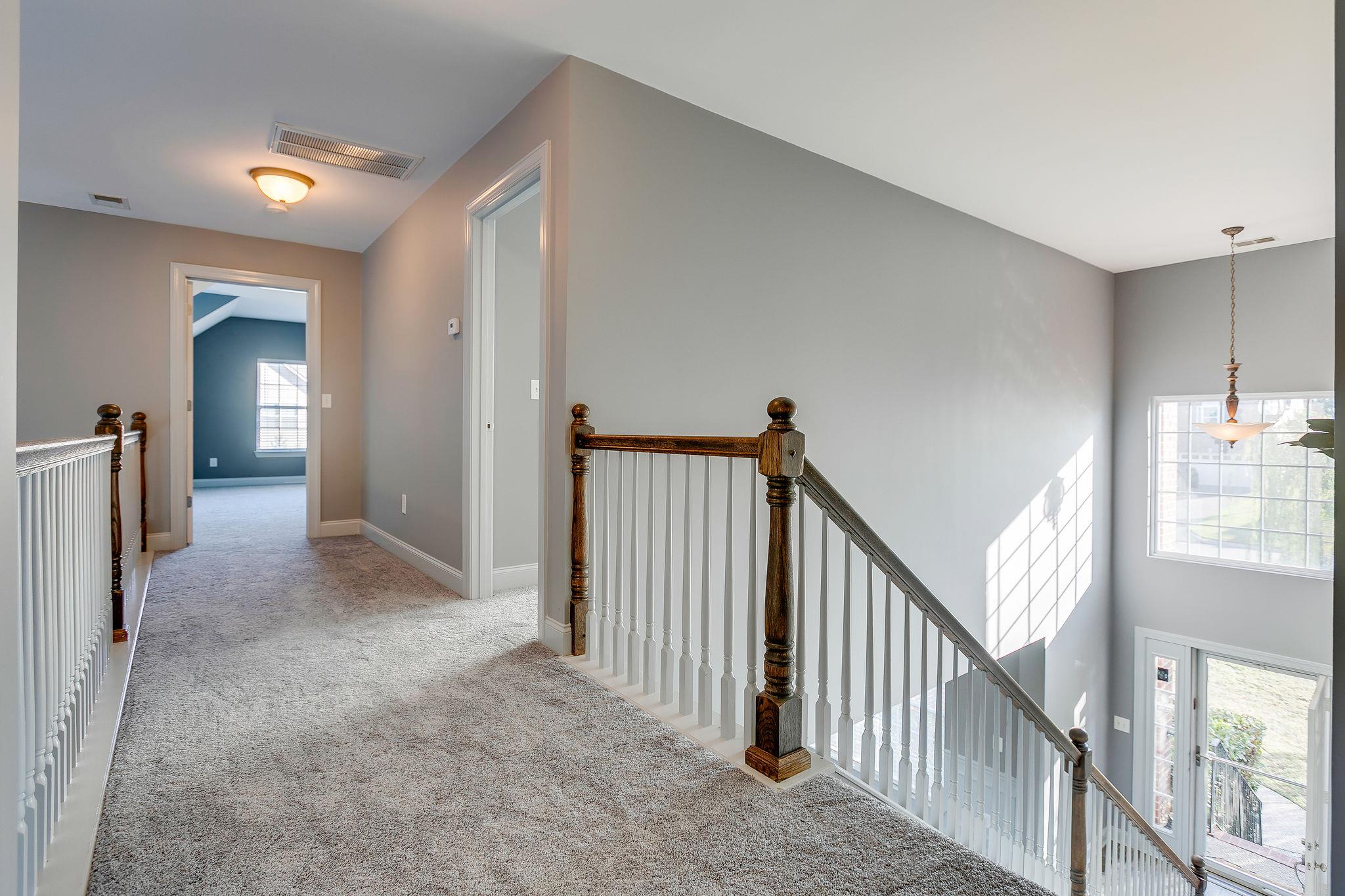 2029 Lincoln Road Spring Hill, TN 37174 - Photo 18 of 30 a view of a livingroom with wooden floor and stairs