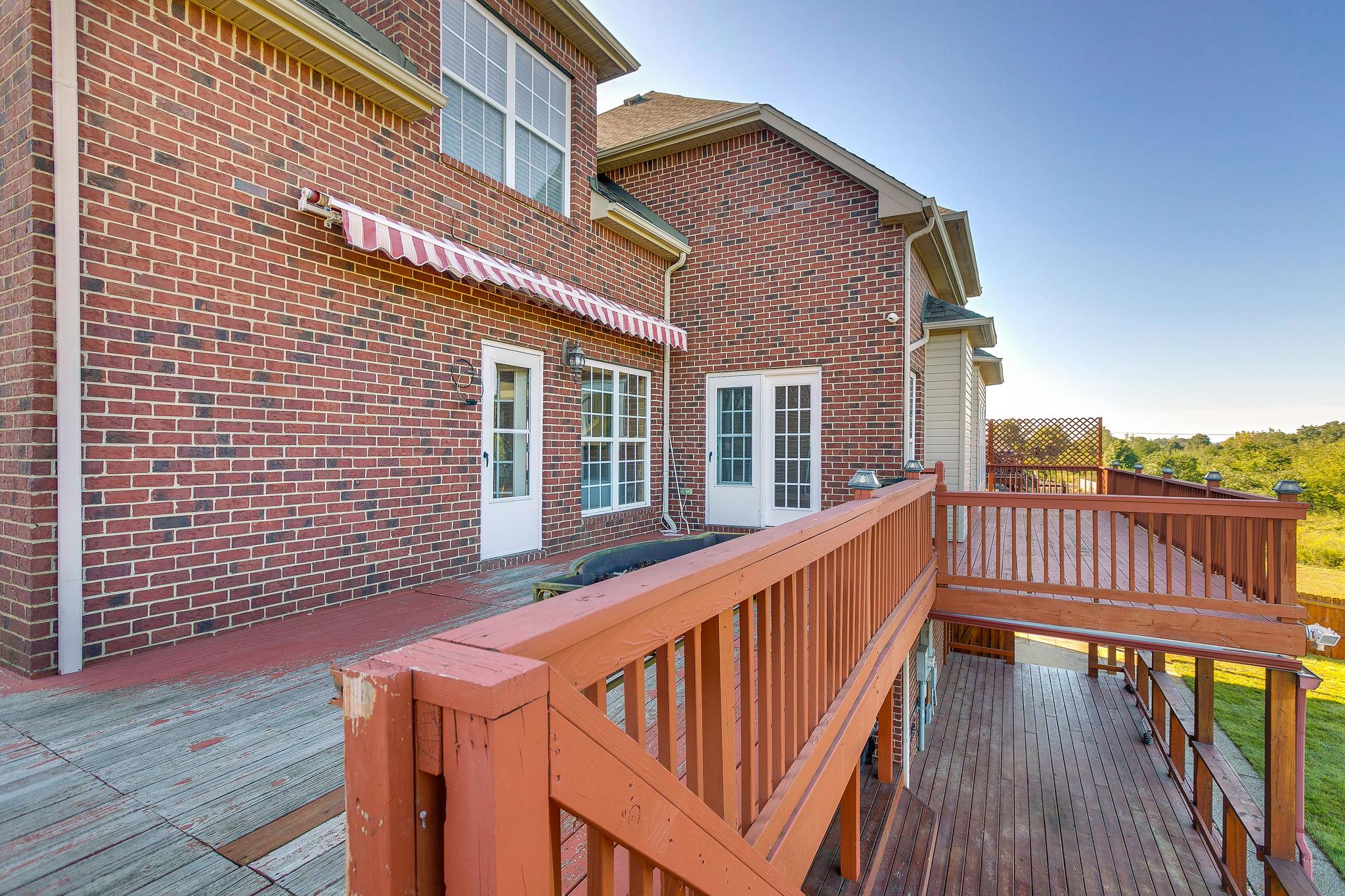 2029 Lincoln Road Spring Hill, TN 37174 - Photo 28 of 30 a view of a house with wooden deck