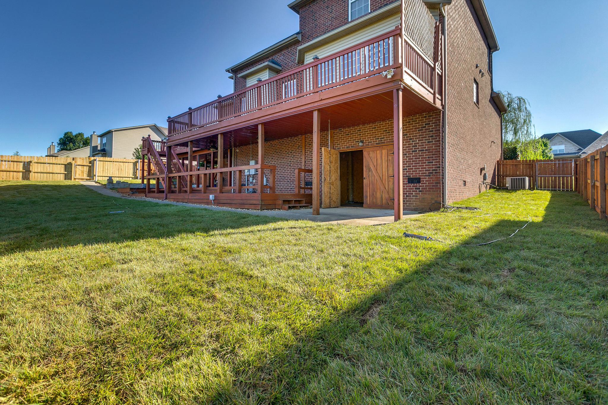 2029 Lincoln Road Spring Hill, TN 37174 - Photo 29 of 30 a view of a house with a yard and pathway