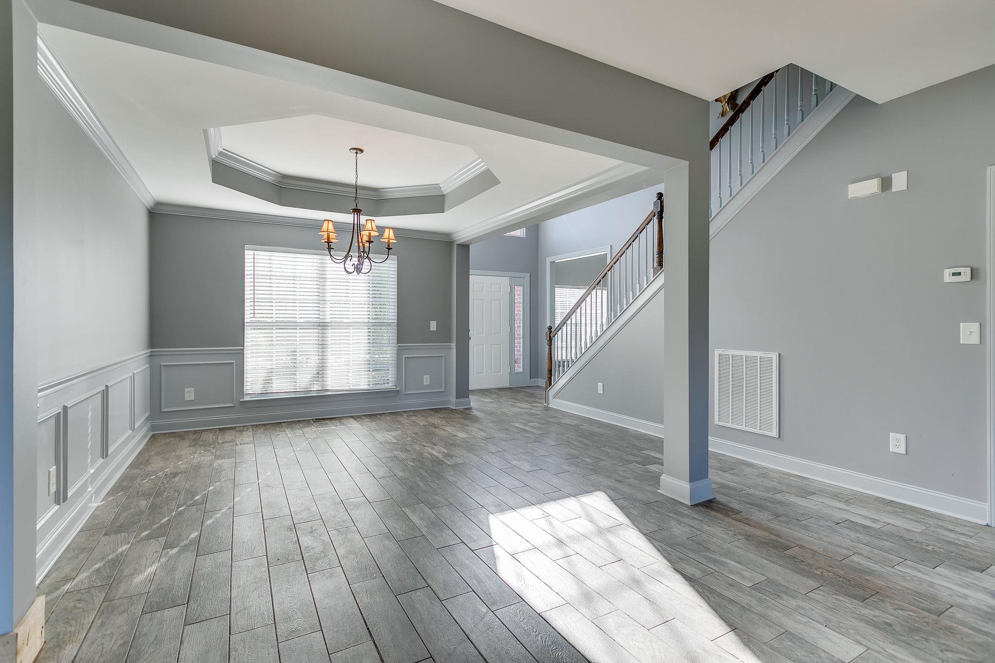 2029 Lincoln Road Spring Hill, TN 37174 - Photo 7 of 30 a view of empty room with wooden floor and fan