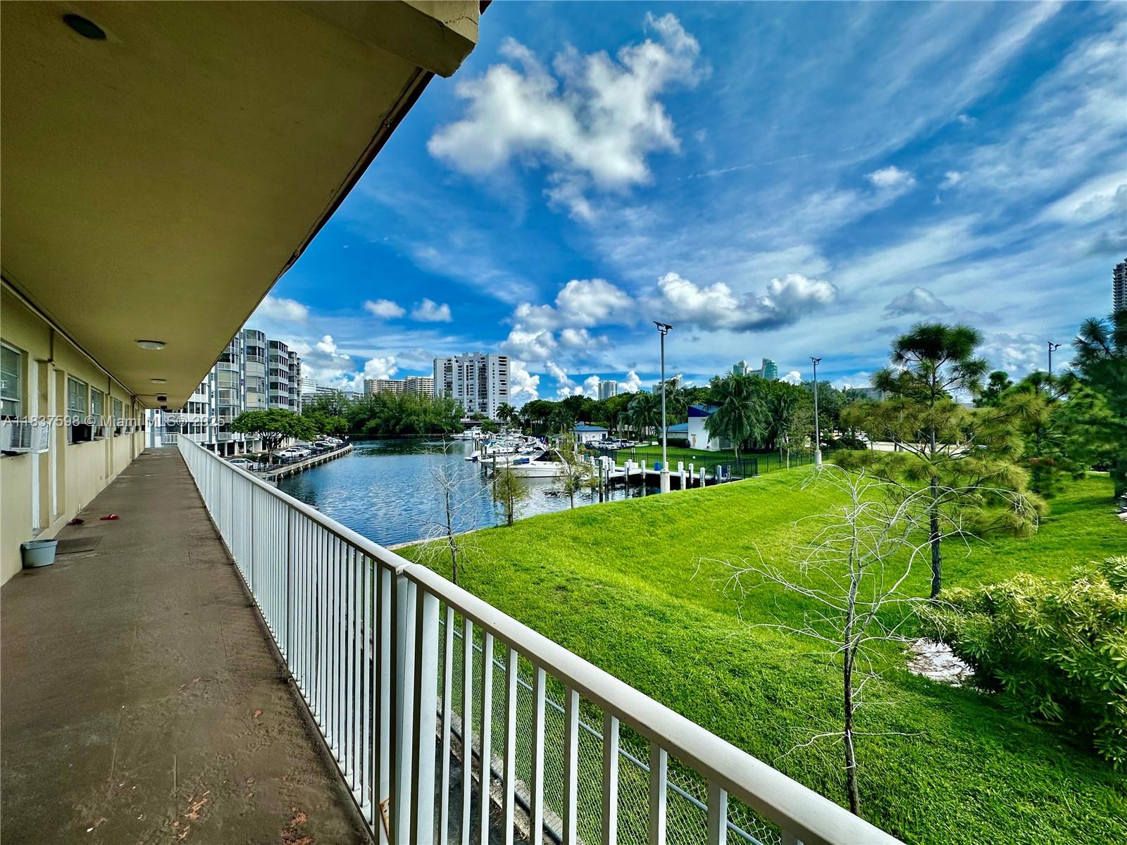 26 Diplomat Parkway, Unit 2368 Hallandale Beach, FL 33009 - Photo 8 of 12 a view of a balcony with yard
