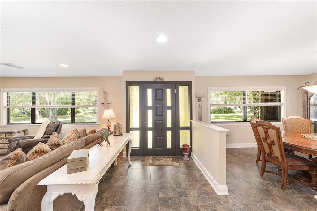 3200 Northeast 97th Street Road Anthony, FL 32617 - Photo 11 of 75 a living room with furniture and large windows