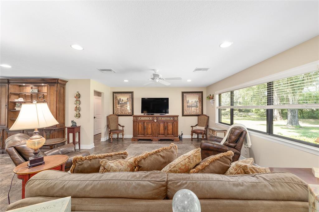 3200 Northeast 97th Street Road Anthony, FL 32617 - Photo 14 of 75 a living room with furniture window and a flat screen tv