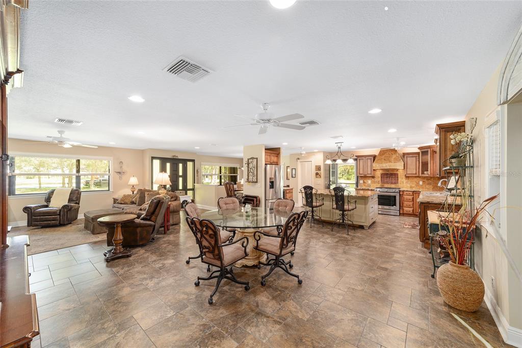 3200 Northeast 97th Street Road Anthony, FL 32617 - Photo 15 of 75 a living room with lots of furniture and a view of kitchen