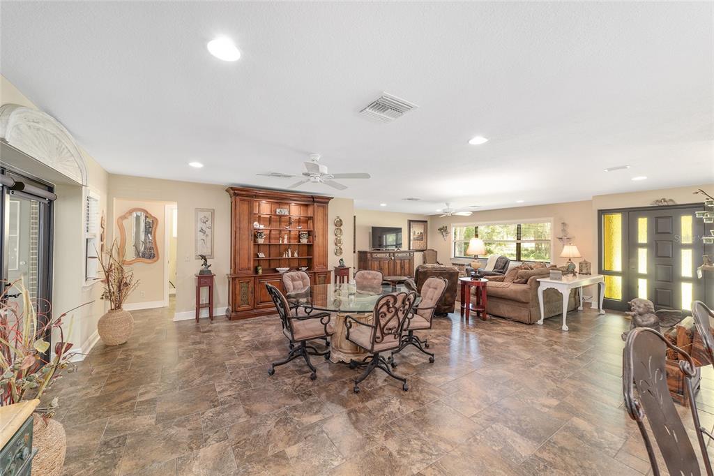 3200 Northeast 97th Street Road Anthony, FL 32617 - Photo 16 of 75 a living room with furniture and large windows