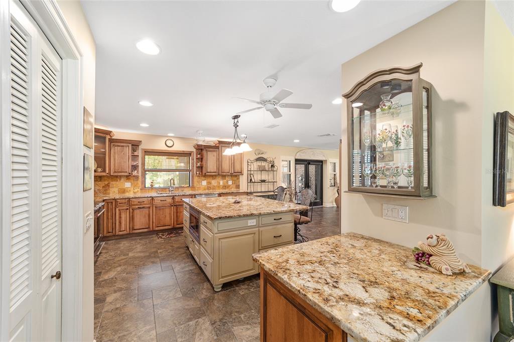 3200 Northeast 97th Street Road Anthony, FL 32617 - Photo 19 of 75 a kitchen with a sink stove and refrigerator