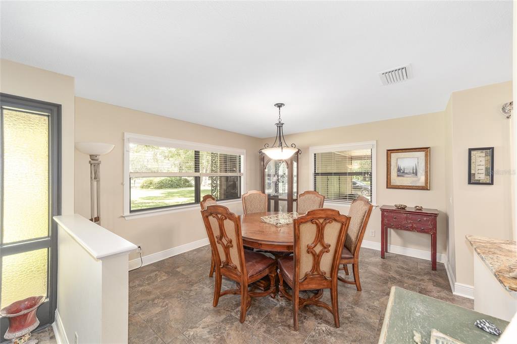 3200 Northeast 97th Street Road Anthony, FL 32617 - Photo 24 of 75 a view of a dining room with furniture window and outside view