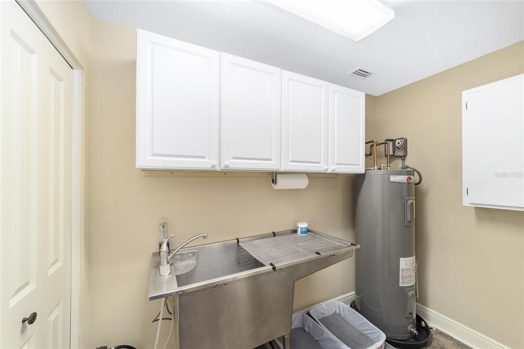 3200 Northeast 97th Street Road Anthony, FL 32617 - Photo 36 of 75 a utility room with sink dryer and washer