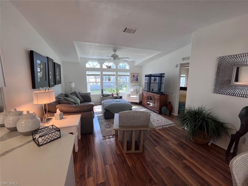 65 Turquoise Avenue, Unit 65T Naples, FL 34114 - Photo 12 of 34 a living room with furniture and a large window