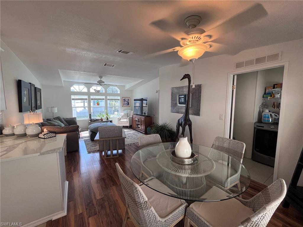 65 Turquoise Avenue, Unit 65T Naples, FL 34114 - Photo 13 of 34 a living room with fireplace furniture and a wooden floor