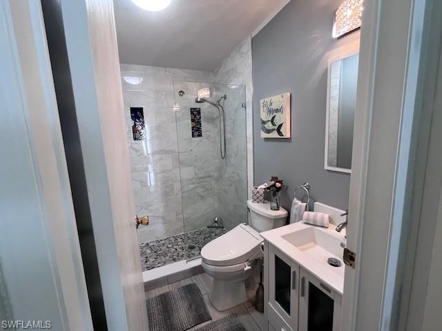 65 Turquoise Avenue, Unit 65T Naples, FL 34114 - Photo 21 of 34 a bathroom with a sink a toilet and shower