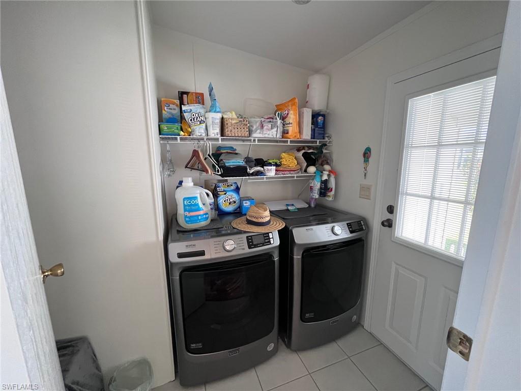 65 Turquoise Avenue, Unit 65T Naples, FL 34114 - Photo 32 of 34 a kitchen with stainless steel appliances a stove and a refrigerator