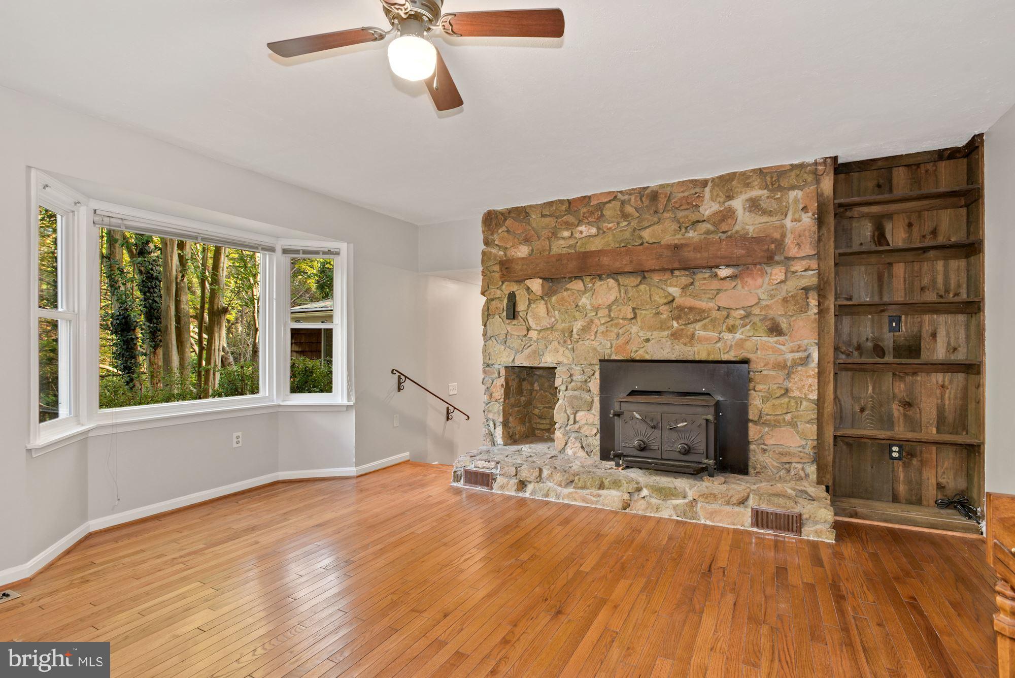 5753 Georgetown Road Broad Run, VA 20137 - Photo 16 of 53 Stone fireplace with wood stove
