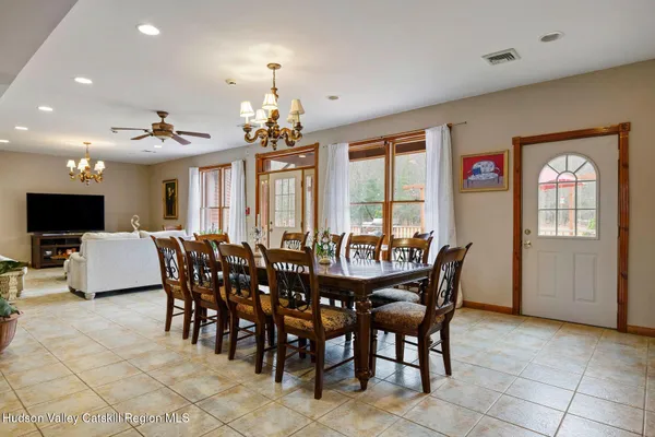 a view of a dining room with furniture window and wooden floor