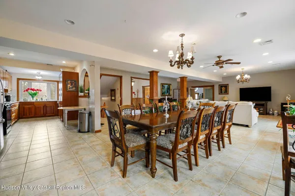 a living room with lots of furniture and wooden floors