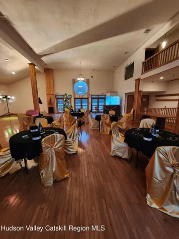 a bedroom with a large bed and a large window