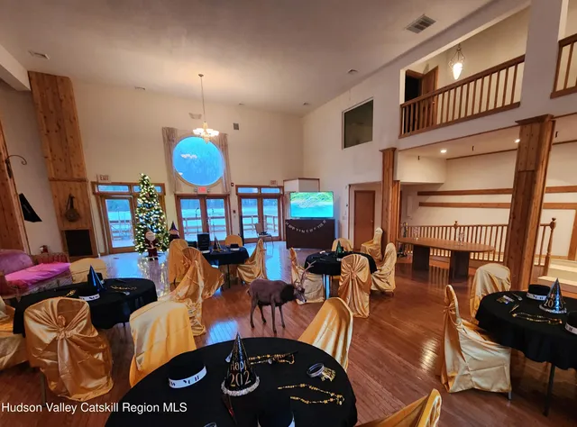 a bathroom with a toilet sink vanity and mirror
