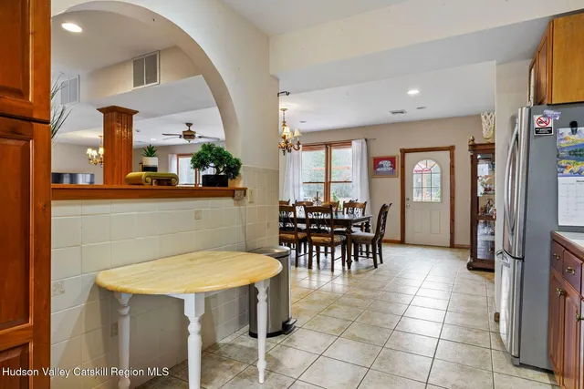 a view of a swimming pool with an outdoor seating and yard in the back