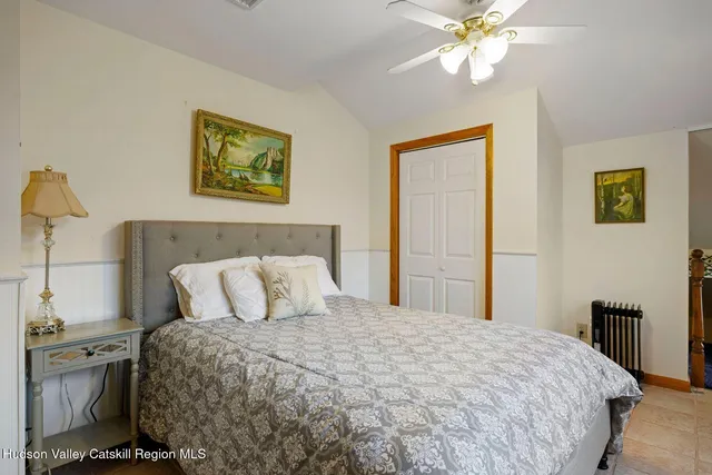 a view of a house with snow on the side of the road
