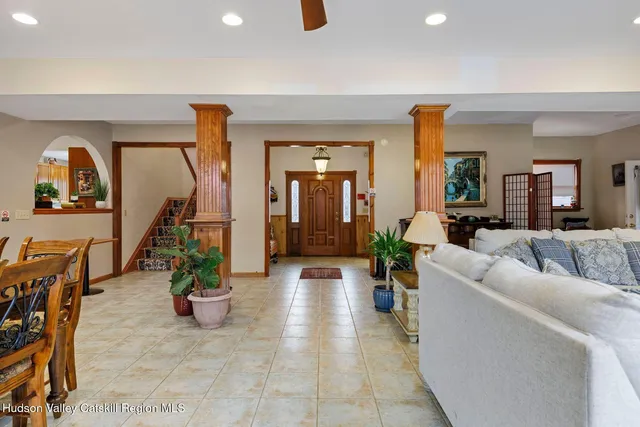 a kitchen with stainless steel appliances granite countertop a refrigerator a stove and a sink