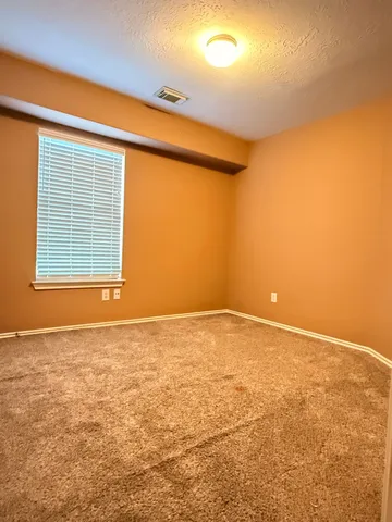 a bathroom with a toilet a sink and shower