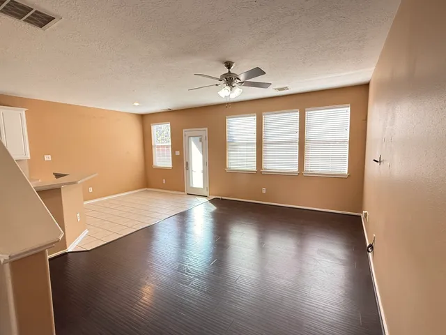 a view of a kitchen with a dishwasher cabinets and a wooden floor