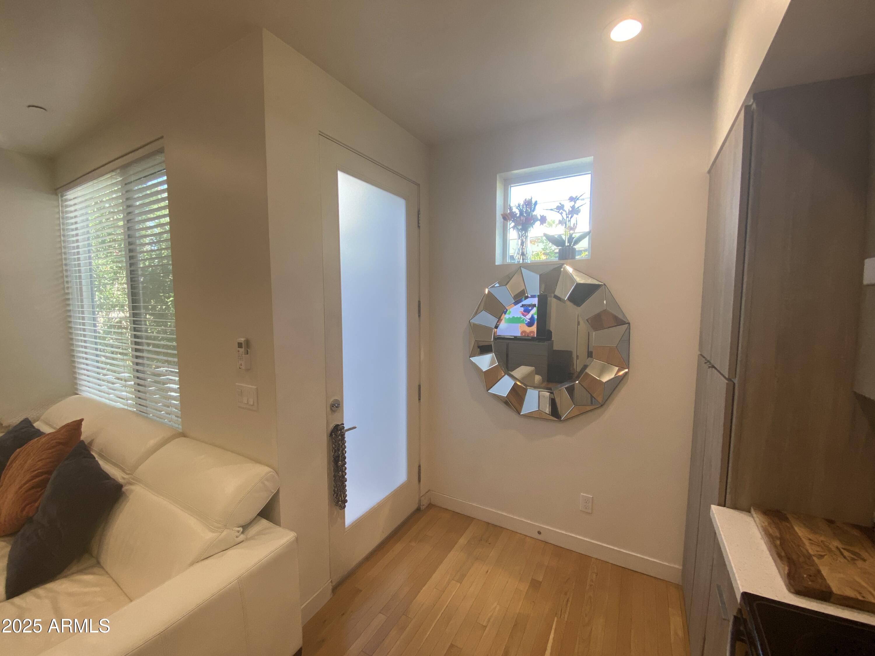 528 West Culver Street, Unit B Phoenix, AZ 85003 - Photo 3 of 7 a living room with furniture and a window