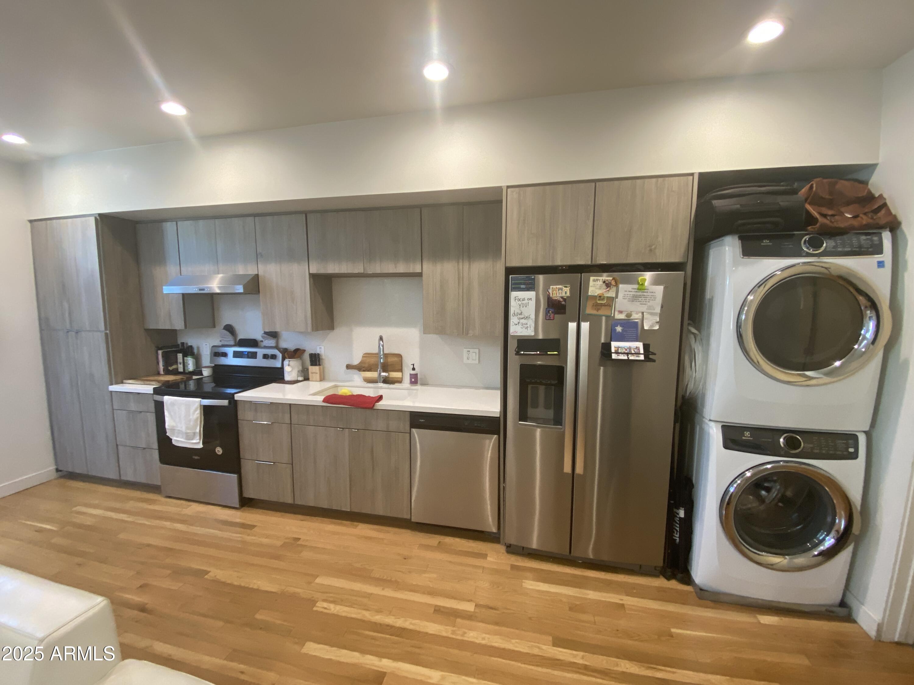 528 West Culver Street, Unit B Phoenix, AZ 85003 - Photo 4 of 7 a kitchen with a refrigerator and washer