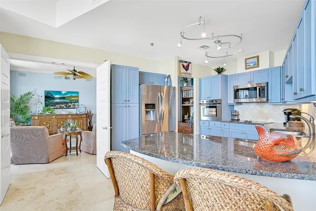 a bedroom with bed and a chandelier