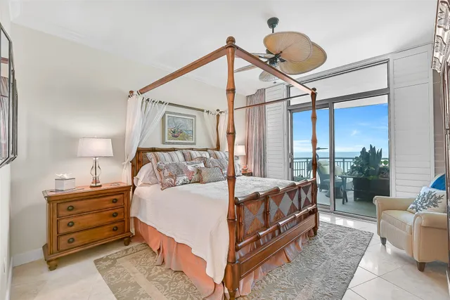 a bedroom with a bed couch and window