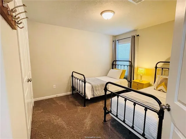 a bedroom with furniture and a window