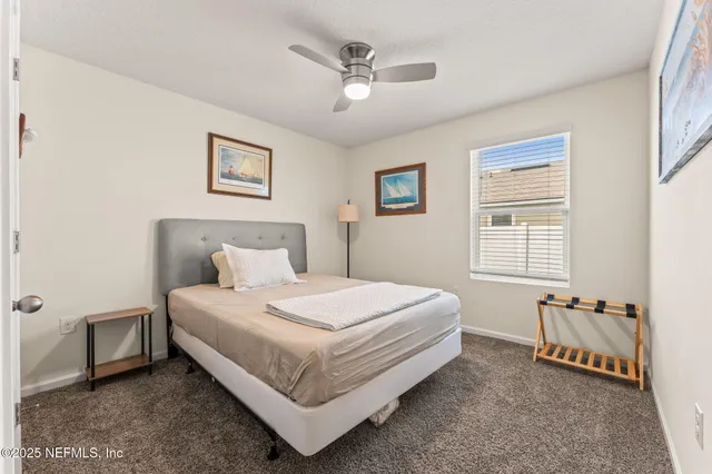 a large white bed in a white room