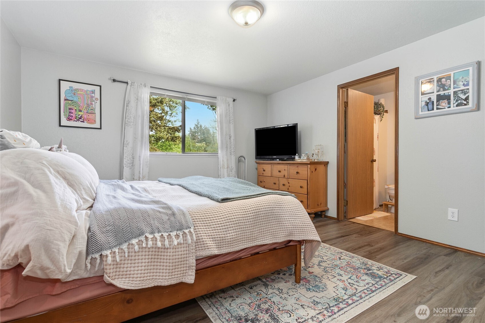 119 North 34th Street Bellingham, WA 98225 - Photo 11 of 21 a bedroom with a bed and wooden floor