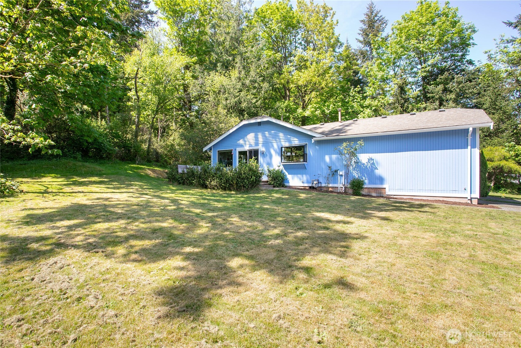 119 North 34th Street Bellingham, WA 98225 - Photo 17 of 21 a front view of a house with a yard and trees