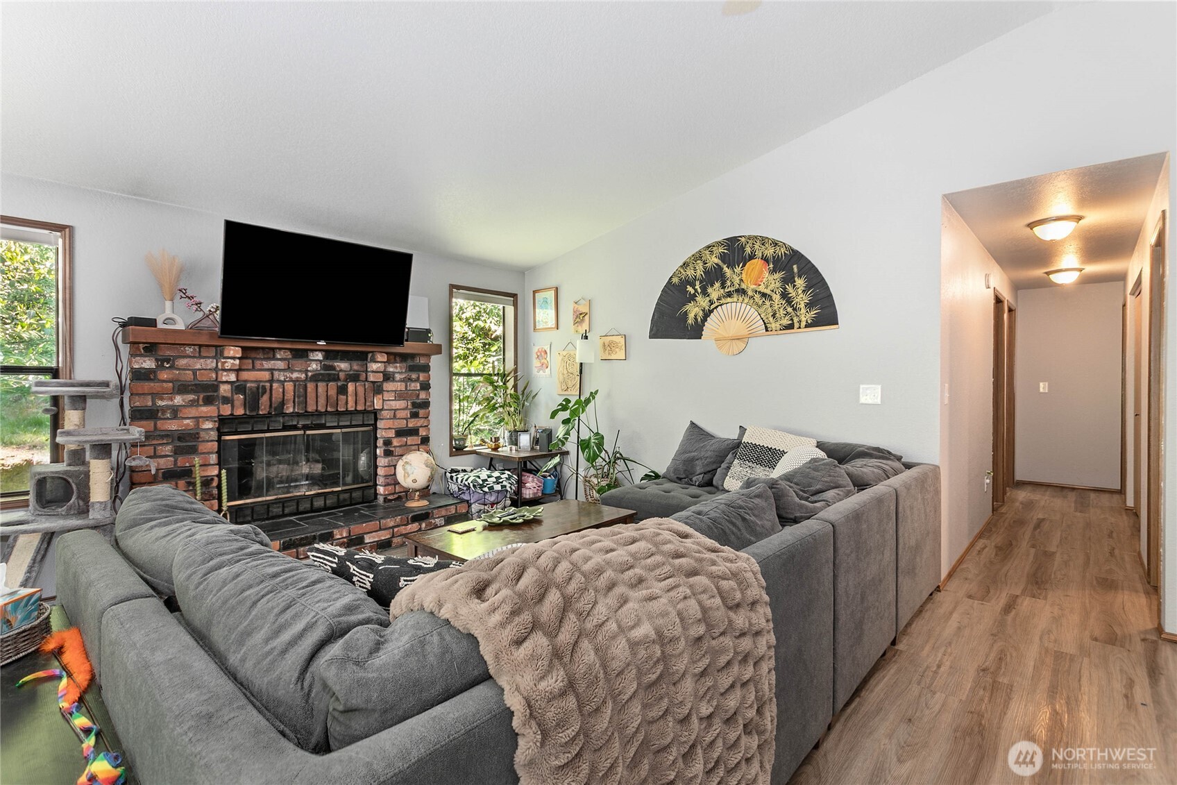 119 North 34th Street Bellingham, WA 98225 - Photo 5 of 21 a living room with fireplace furniture and a flat screen tv