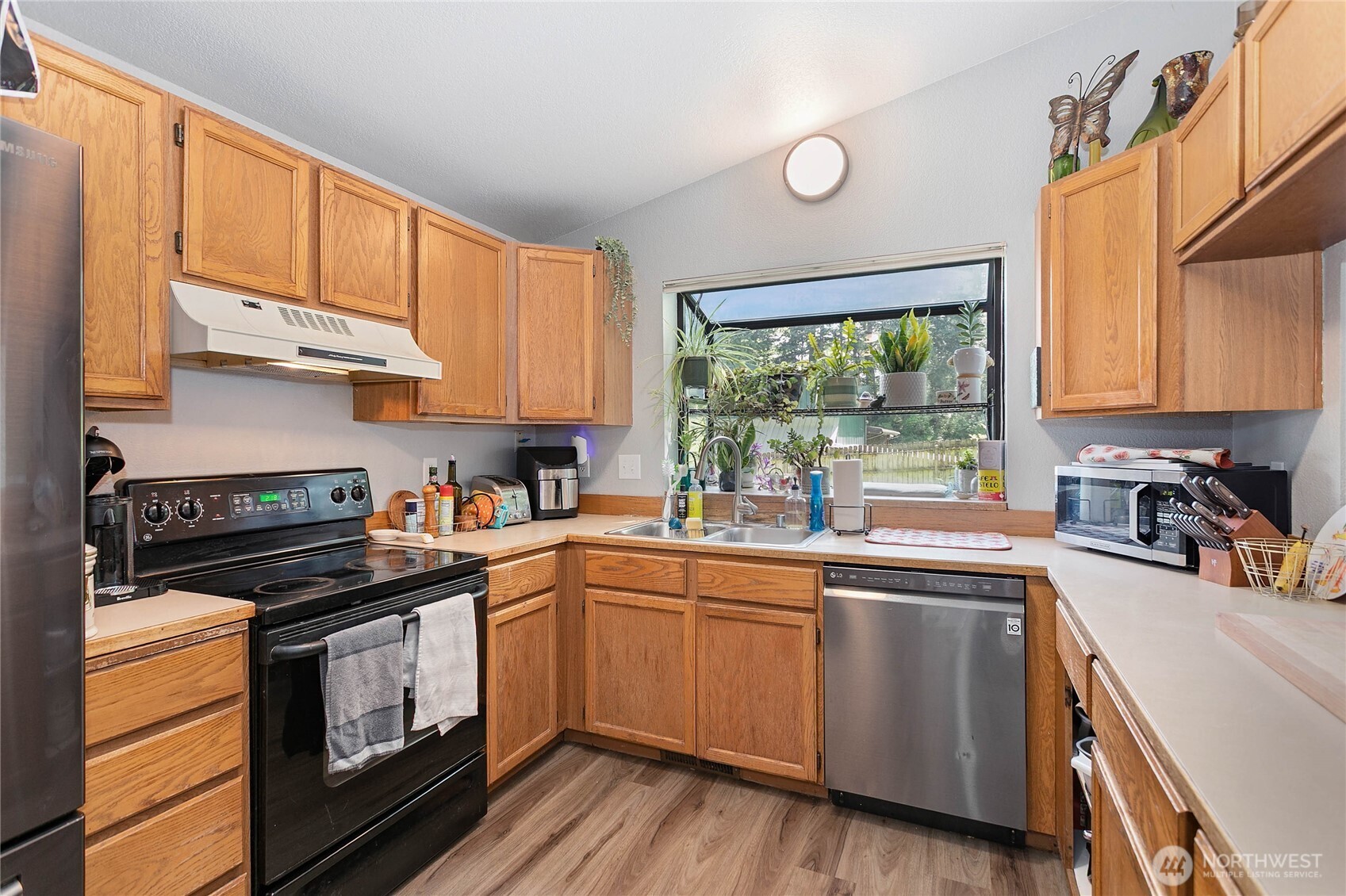 119 North 34th Street Bellingham, WA 98225 - Photo 8 of 21 a kitchen with a sink stove and cabinets