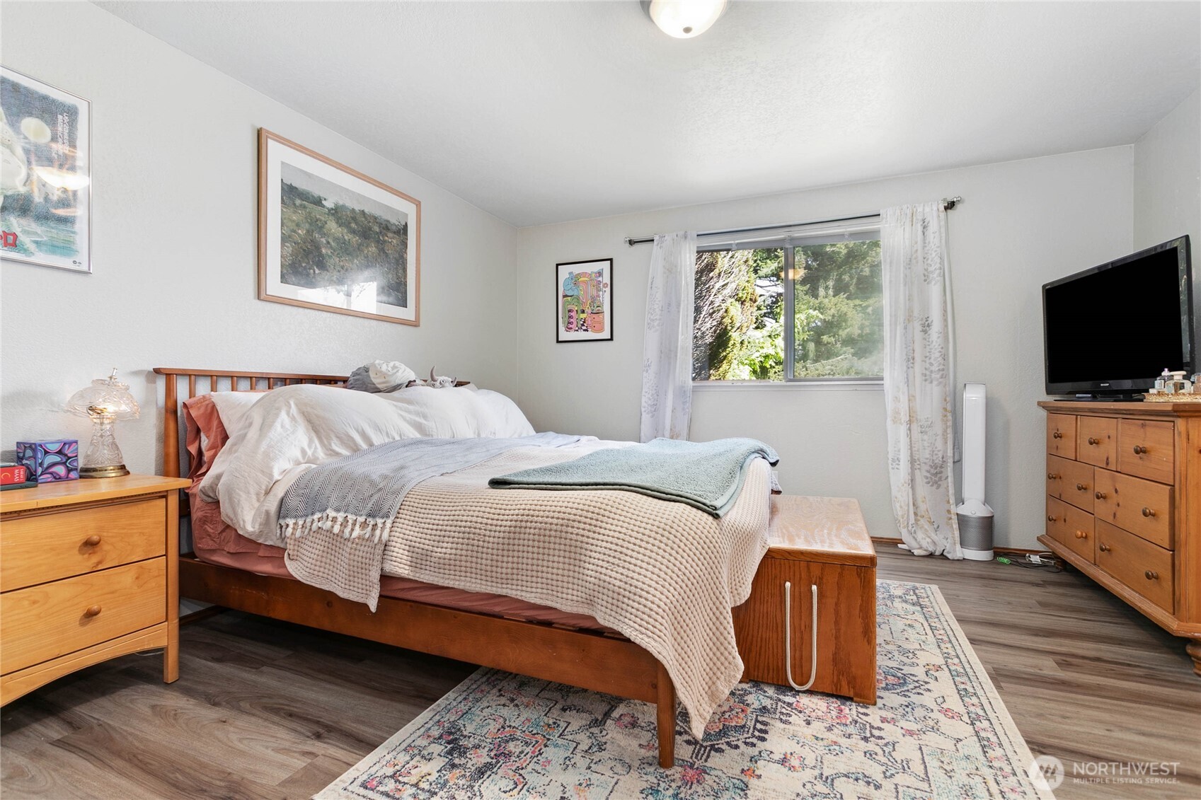 119 North 34th Street Bellingham, WA 98225 - Photo 10 of 21 a bedroom with a bed and a flat screen tv