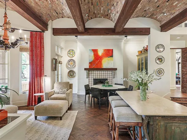 a dining room with furniture and wooden floor