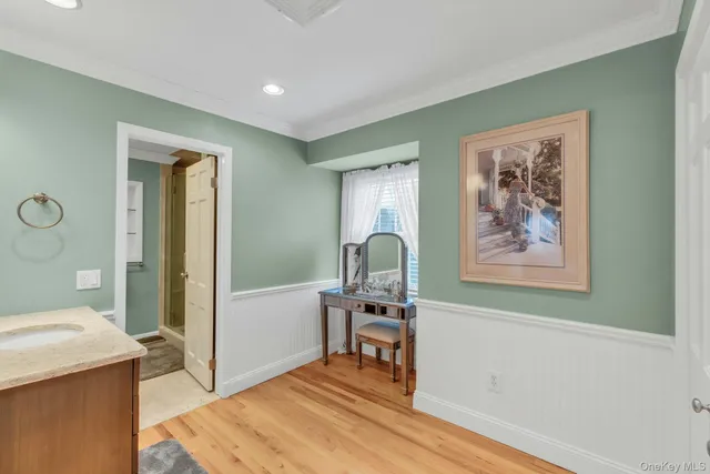 a view of a room with furniture and wooden floor