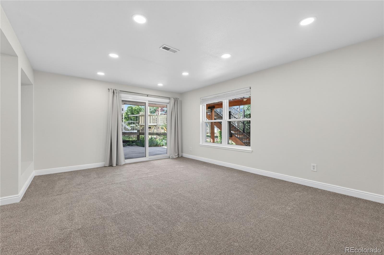 1774 Spring Water Place Highlands Ranch, CO 80129 - Photo 33 of 49 an empty room with windows