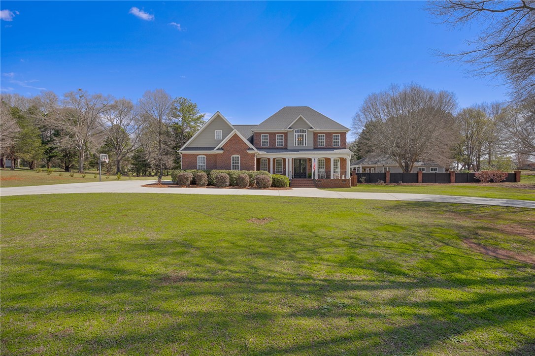233 Bowen Drive Anderson, SC 29621 - Photo 4 of 50 This spacious estate offers a generous front lawn and mature trees.