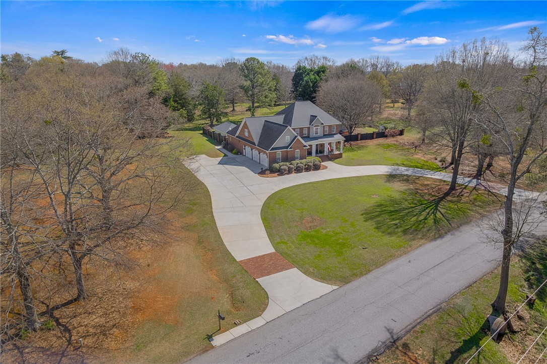 233 Bowen Drive Anderson, SC 29621 - Photo 46 of 50 This grand brick home offers a stately presence with a circular driveway with an abundance of parking.