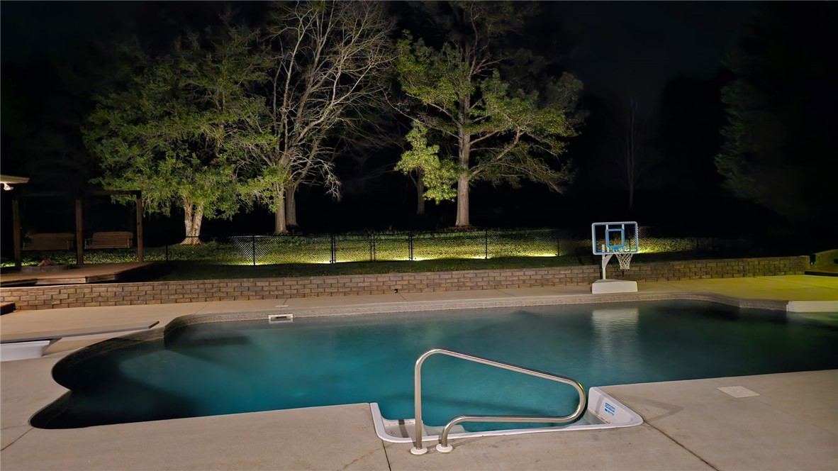 233 Bowen Drive Anderson, SC 29621 - Photo 49 of 50 How about a night swim on hot summer night? Enjoy this inviting pool, surrounded by subtle landscape lighting and mature trees.