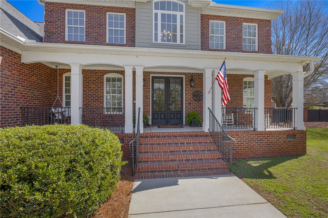 233 Bowen Drive Anderson, SC 29621 - Photo 5 of 50 This classic brick residence features a welcoming porch, perfect for enjoying peaceful moments outdoors.