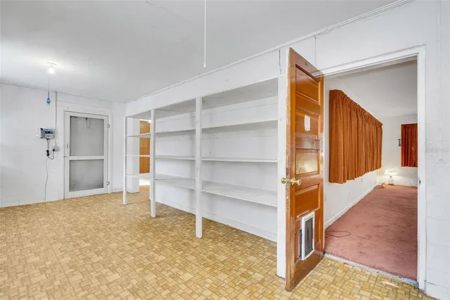 a backyard of a house with plants and garden