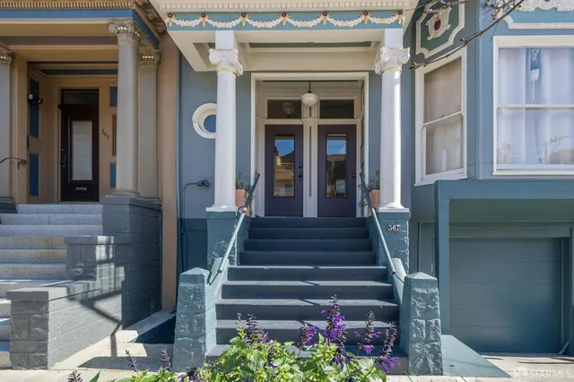 a view of a building with entryway and windows