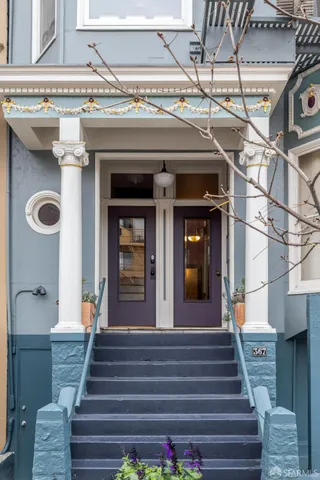a view of a staircase with a fireplace