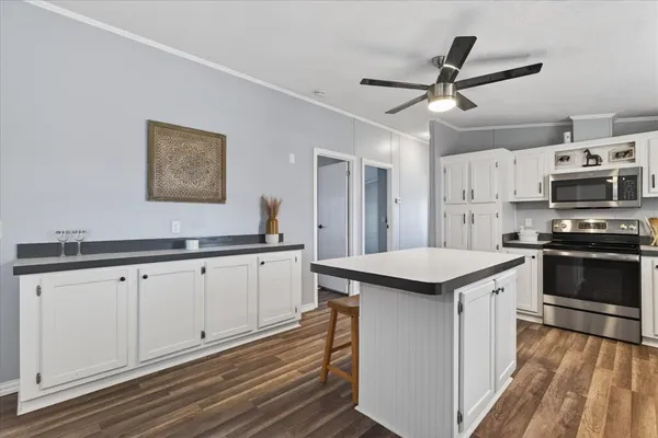 a kitchen with stainless steel appliances granite countertop a stove and a sink
