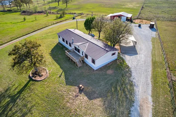 an aerial view of a house with a ocean view